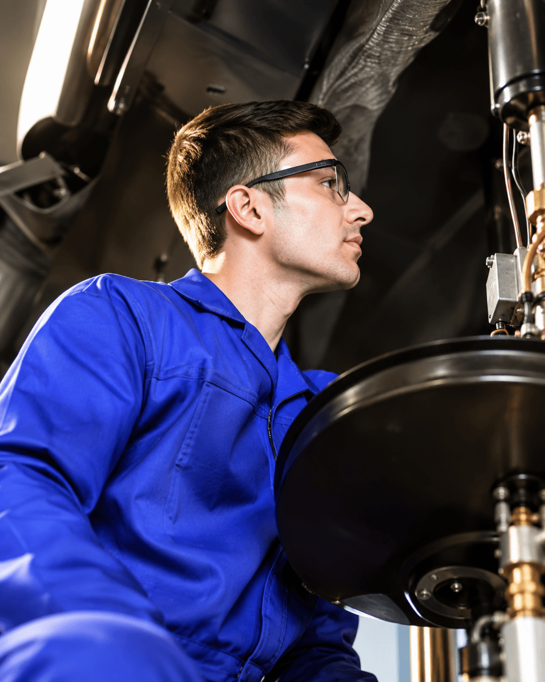 Technician inspecting a kitchen burner